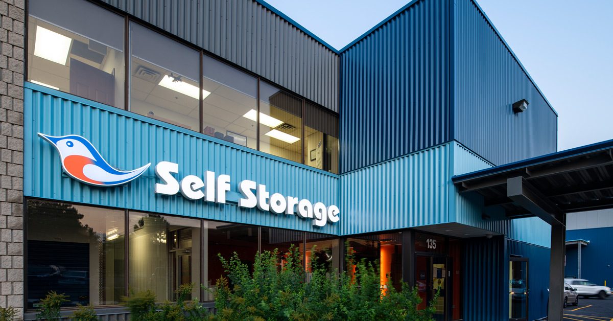 Outside View of Bluebird Self Storage Management Sign On Building