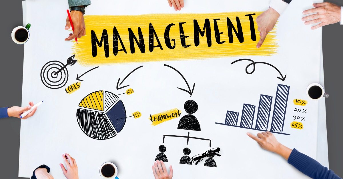 Workers at Table Grouped Around Storage Management in Toronto Graphic